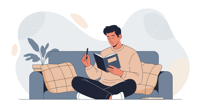 A man reading and writing in a journal while relaxing on a comfortable sofa at home