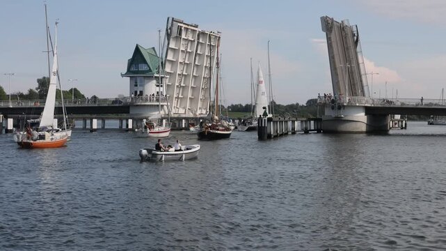 Schlei Bridge in Kappeln closing as sailboats pass through a channel