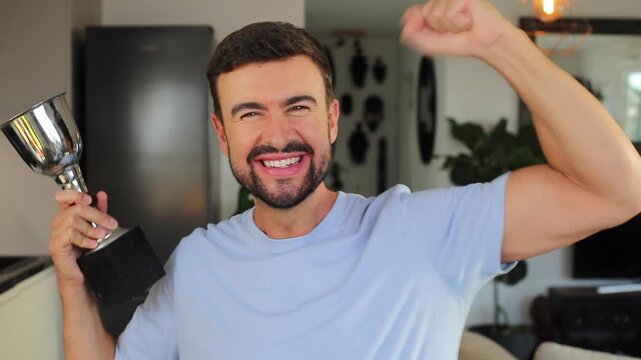 Proud man holding his trophy