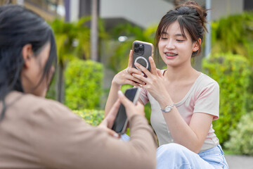 women teen girl playing smartphone games, student using smart AI technology device in lifestyle