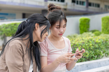 women teen girl playing smartphone games, student using smart AI technology device in lifestyle