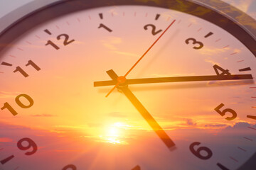 Day Time, Time clock face double exposure with summer morning sun rise beautiful sky background.