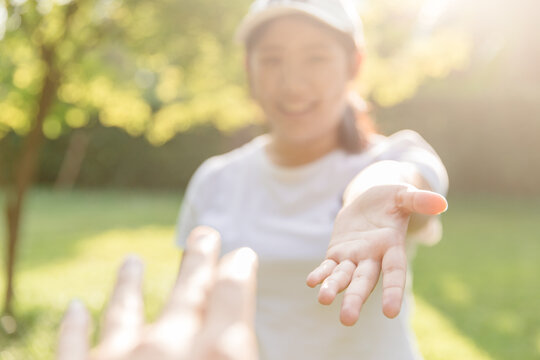 Girl teen smiling and reach her hand. Help Touch Care Support be a Good Friend with Love concept.