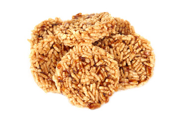 Traditional Thai crispy rice crackers topped with sweet caramel syrup. Delicious local snack made from puffed rice, showcasing Thai dessert culture and homemade traditional taste.    