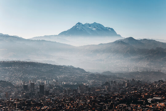 panorama of the city of la paz at sunrise with illimani in the background