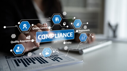 A professional business person examines compliance data using a digital interface in a modern...