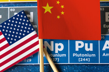 Periodic table with Chinese and American flag.