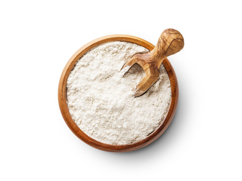 Wheat flour in wooden bowl with spoon isolated on white background with clipping path.