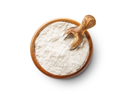 Wheat flour in wooden bowl with spoon isolated on white background with clipping path.