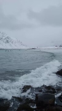  Skagsanden Beach in the Lofoten Islands, Norway in the winter on a cloudy day.
