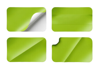 Four lime green rectangular adhesive labels with rounded corners, varied wear & tear, on a transparent background with copy space, soft studio light. Concept for branding templates