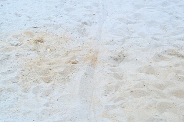 Obraz premium Sand is beige and white, and patterns are seen due to different textures.