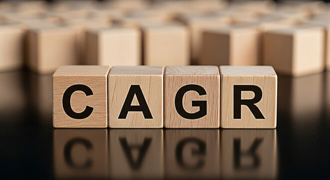 Wooden blocks spelling out "CAGR" represent compound annual growth rate in finance and investment strategy on a reflective black surface