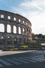 vertical view of the roman ancient arena of pula, in croatia, on a golden morning