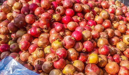 A Large Display of Freshly Harvested Pomegranates