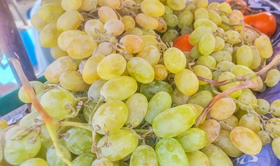 Fresh Green and Yellow Grapes at a Market Stall