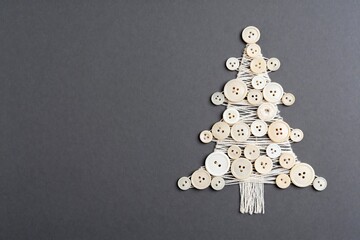 New Year's tree made of threads and buttons