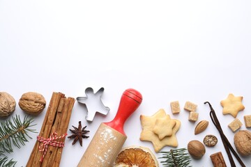 Christmas composition with fir tree branches, cookies and spices on white background, flat lay. Space for text