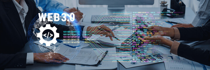 A diverse team engages in a collaborative meeting at a modern office, focusing on Web 3.0 concepts, highlighted by digital coding visuals and innovative interfaces. Trope