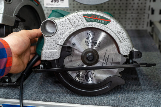 DWT Hand Held Circular Saw on Display in Hardware Store. Selection and purchase of power tool, for home improvement and construction projects. Minsk, Belarus - june 26, 2022