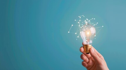 Hand Holding Creative Light Bulb with Digital Network Connection on Blue Background