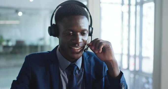 Laptop, man and talking with headset in call center for online advice, account management and help. Customer service agent, black person and speaking to client for inbound query, assistance and CRM
