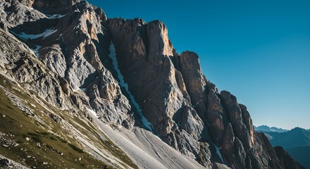 The steep, intimidating slope of a mountain face.