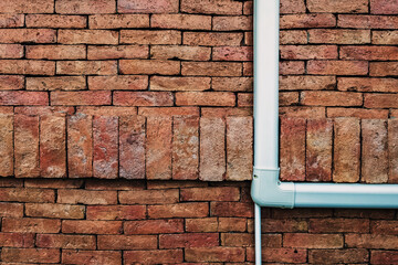 Ventilation system. Air conditioner duct cover or Slim Duct or Duct liner installed on brick wall to protect refrigerant lines and keep installation neat and tidy. Air conditioning refrigerant pipe.