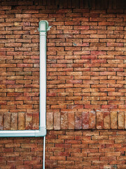 Ventilation system. Air conditioner duct cover or Slim Duct or Duct liner installed on brick wall to protect refrigerant lines and keep installation neat and tidy. Air conditioning refrigerant pipe.