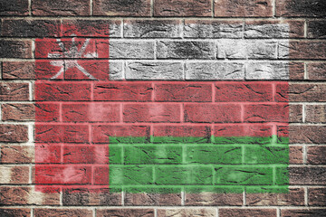 Oman flag on old brick wall background