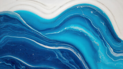 Close up of a blue and white resin art with wave like patterns and swirls