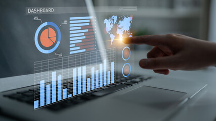 An interactive business analytics dashboard shown on a laptop screen, featuring data visualization elements like graphs and charts, highlighting modern corporate analysis. Impute