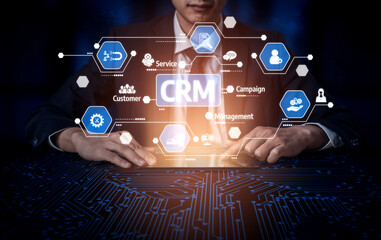 Fototapeta premium A business professional engages with interactive digital CRM icons, emphasizing the importance of customer relationship management in modern corporate strategies. Tessel