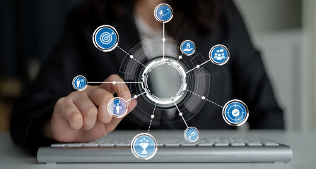 A visually compelling representation of digital transformation showing a businesswoman interacting with technology through a keyboard and various infographic icons. Crux