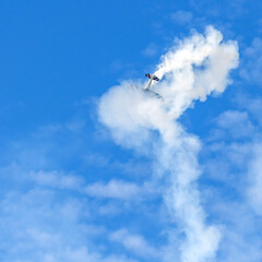 Acrobatic planes and helicopters perform stunning maneuvers in the sky during Festivolare 2025 airshow, thrilling the crowd with aerial stunts.