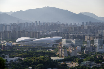 Urban Skyline and Modern Architectural Complex with Mountainous Background