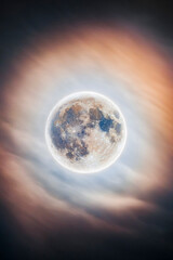 Night Sky with Full Moon and Cloudy Atmosphere