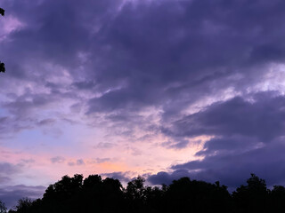Sunset sky clouds in the Evening with Golden orange sunlight in golden hour, Dusk sky background