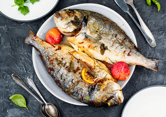 Grilled dorado fish with plums.