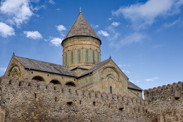 Fototapeta premium The outside view of Svetitskhoveli Cathedral which is an Orthodox Christian cathedral located in the historic town of Mtskheta, Georgia.
