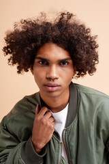 Obraz premium Young man with curly hair wearing nose piercing