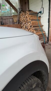 electric vehicle charging at wallbox at home