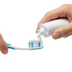 Person Squeezing Toothpaste Onto A Blue And White Toothbrush With Clean Teeth