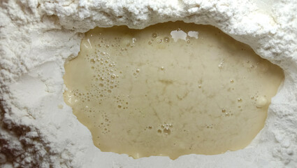 Flour on the sides and liquid mixture in the middle