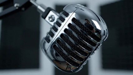 Shiny classic retro microphone in a recording studio environment - Powered by Adobe