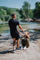 A moment of friendship by a picturesque lakeside, surrounded by nature on a sunny day.