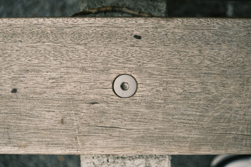 A wooden board with a small hole in the middle