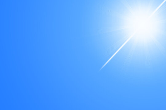 Sun in blue sky. Bright warm sun and lens flare in clear summer sky, sunlight with sunshine glare rays.
