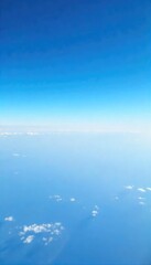 Vast, cloudless expanse of blue sky, perfect for serene and peaceful imagery Ideal for travel, nature, and weather-related projects Shot at high altitude for maximum impact , blue, expansive