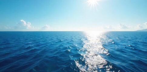 Vast, deep blue ocean stretches to the horizon, untouched and serene Sunlight glints on the endless water, creating a mesmerizing display of light and shadow , travel, summer, serene